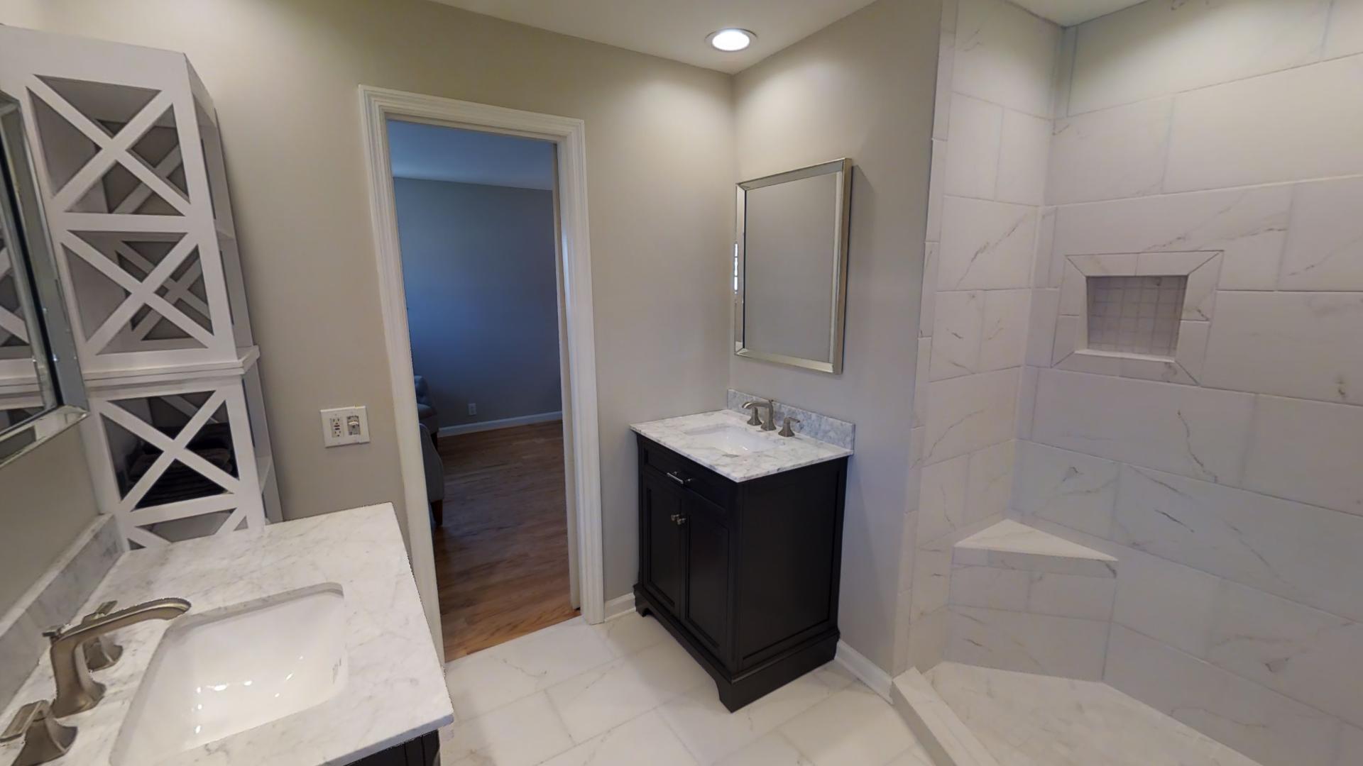 4425 Prescott Road Nashville, TN 37204 - Photo 14 of 26 a bathroom with a sink a vanity and a mirror