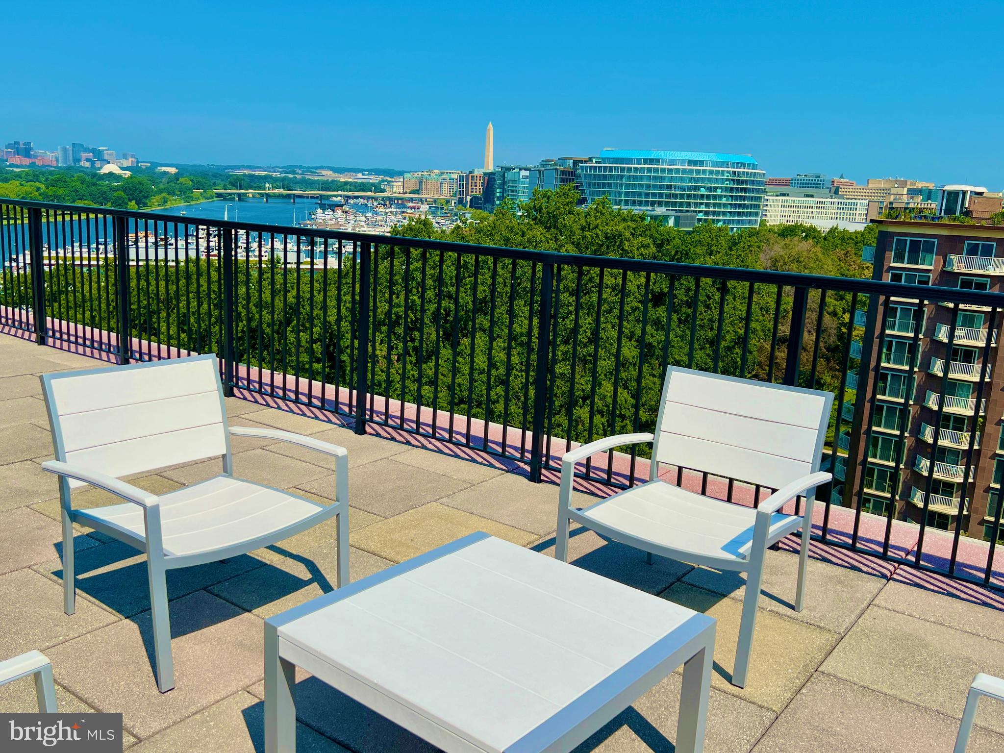 520 N Street Southwest, Unit S622 Washington, DC 20024 - Photo 15 of 25 a view of a chairs and table on the terrace