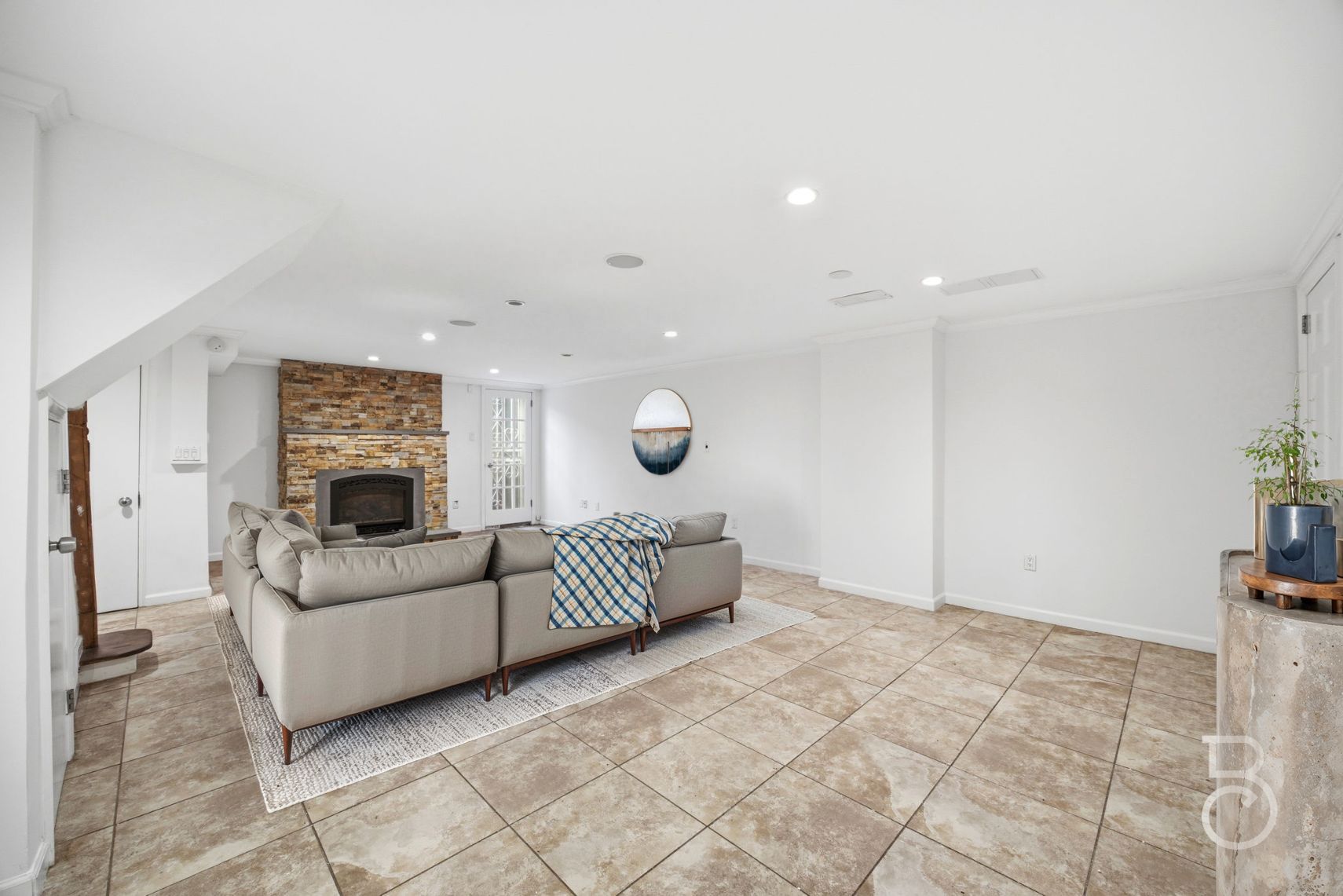 22-61 46th Street Queens, NY 11105 - Photo 12 of 24 a living room with furniture and a fireplace