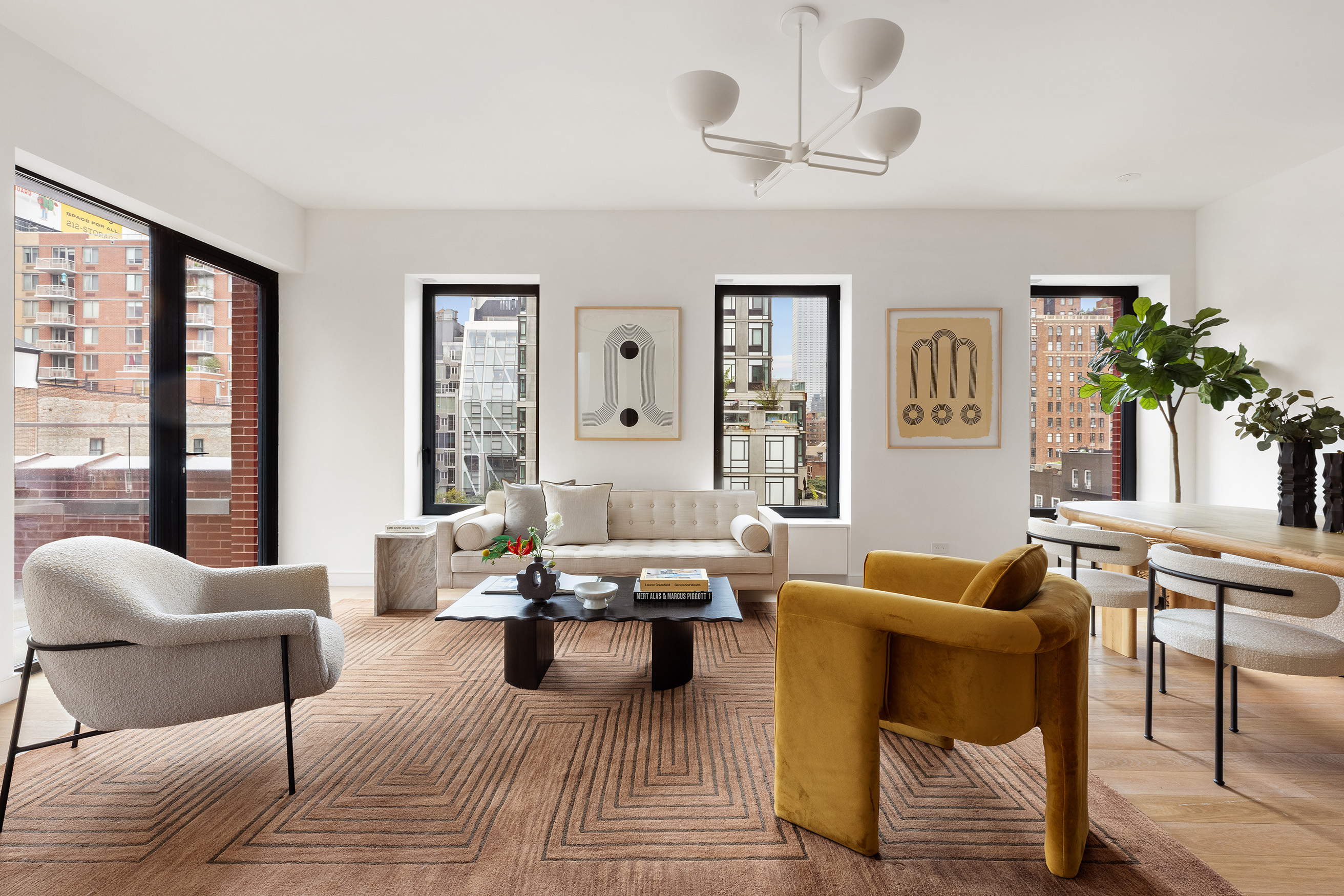 500 West 22nd Street, Unit PHW Manhattan, NY 10011 - Photo 5 of 28 a living room with furniture floor to ceiling window and potted plant