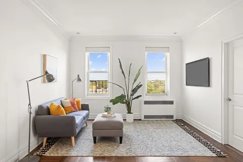a living room with furniture and a rug