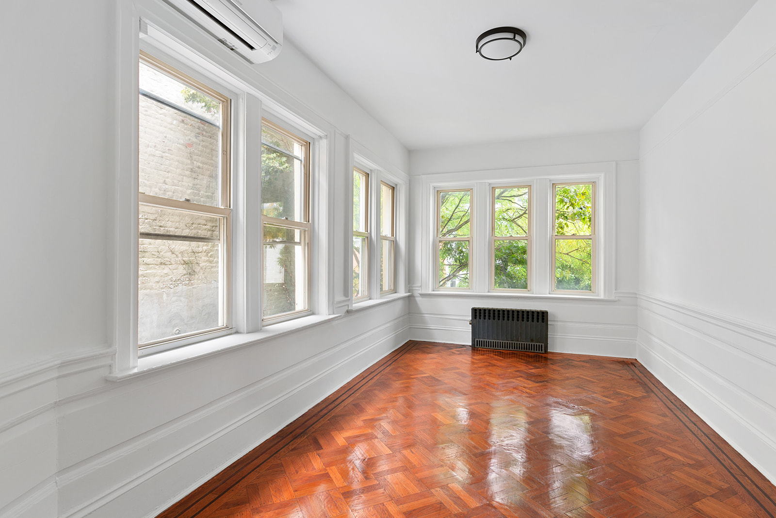 165 Fenimore Street Brooklyn, NY 11225 - Photo 7 of 13 an empty room with large windows