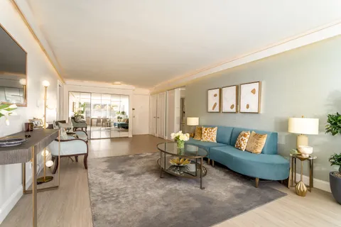 a living room with furniture and a table