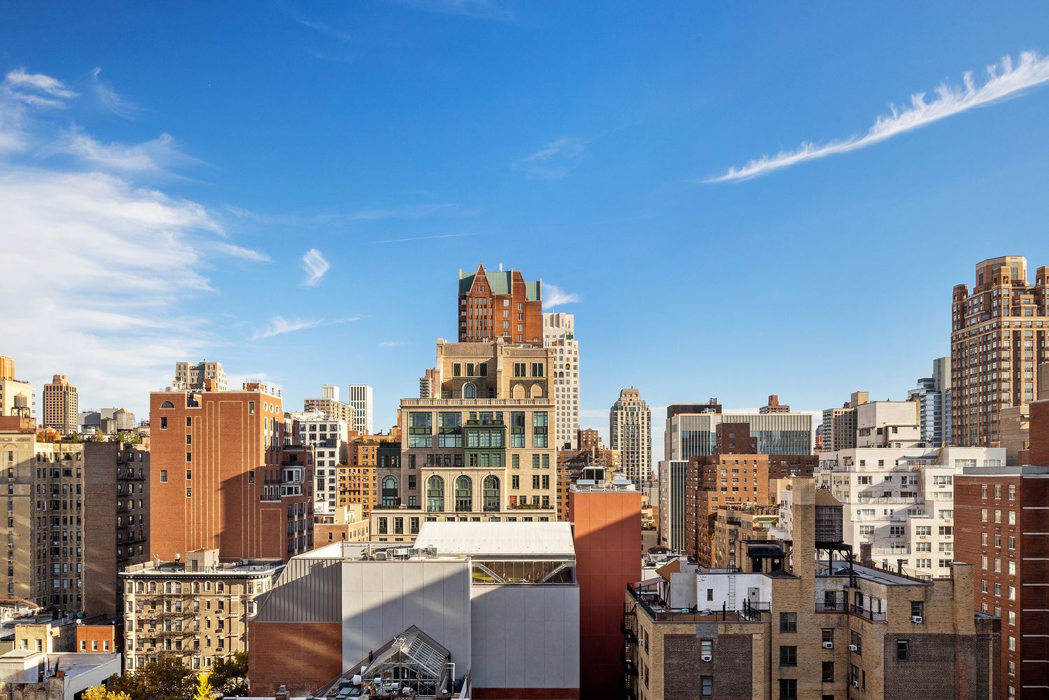 a view of a city with tall buildings