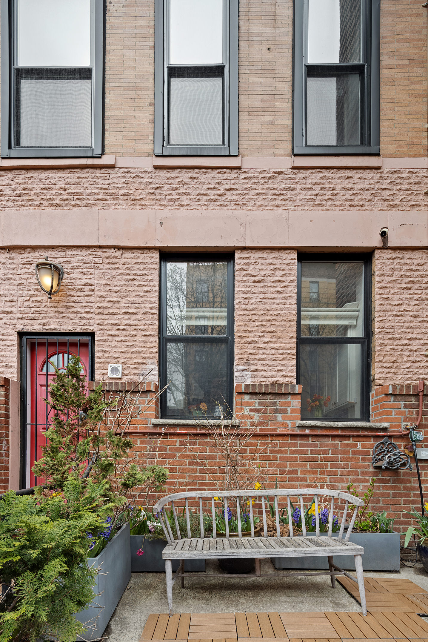 657 West 183rd Street Manhattan, NY 10033 - Photo 20 of 22 a front view of a house with stairs