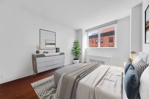 a room with a bed and a mirror