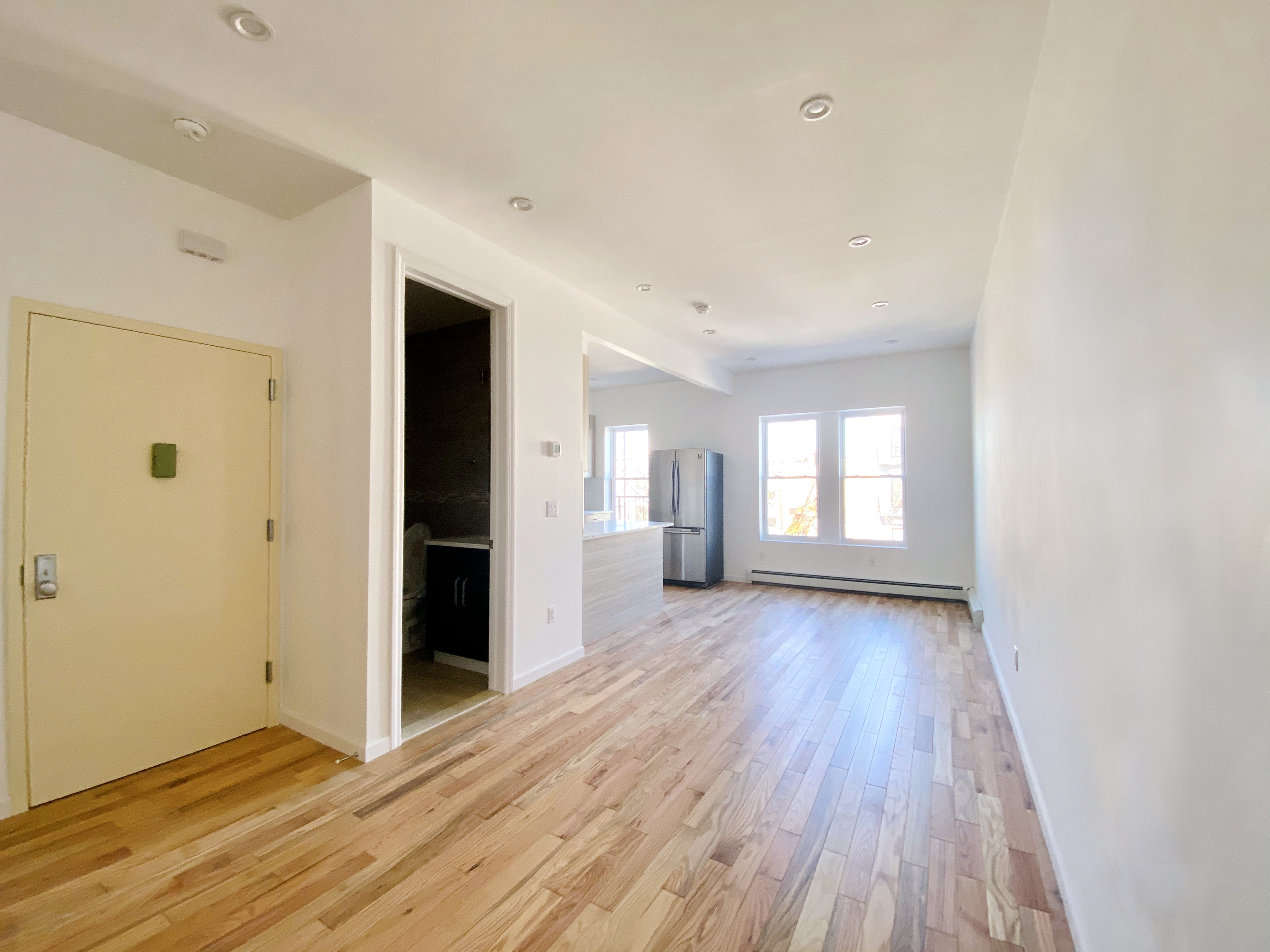 175 Luquer Street, Unit 4 Brooklyn, NY 11231 - Photo 11 of 21 a view of an empty room with window and wooden floor