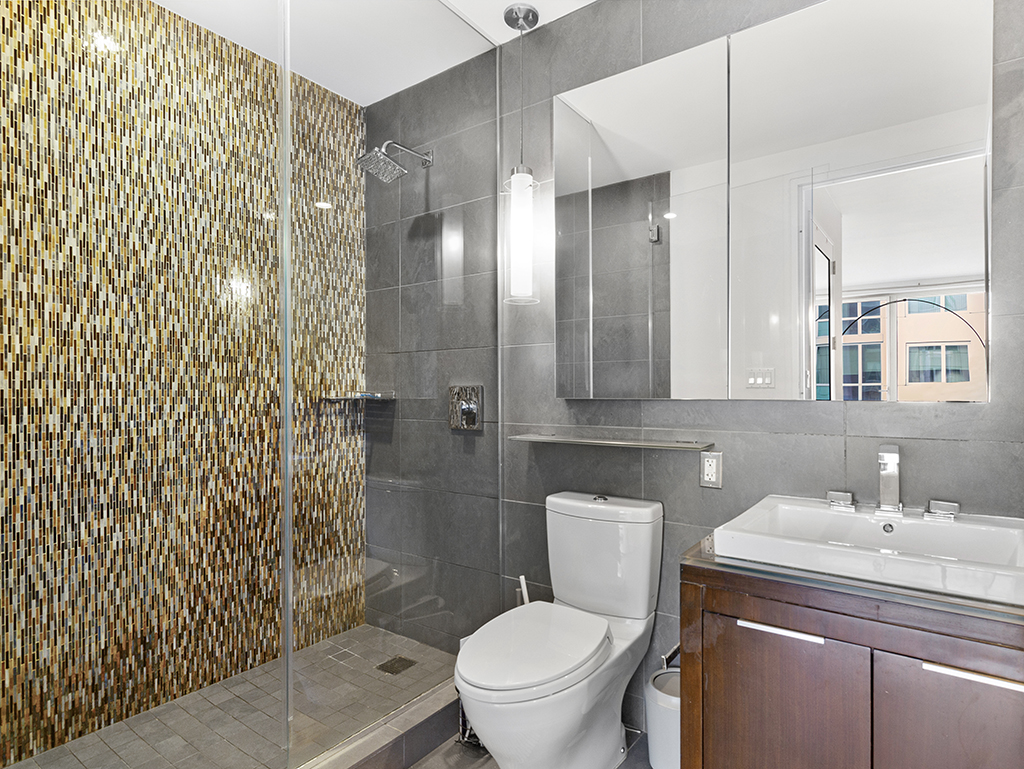 22 North 6th Street, Unit 7I Brooklyn, NY 11249 - Photo 5 of 19 a bathroom with a sink toilet and shower