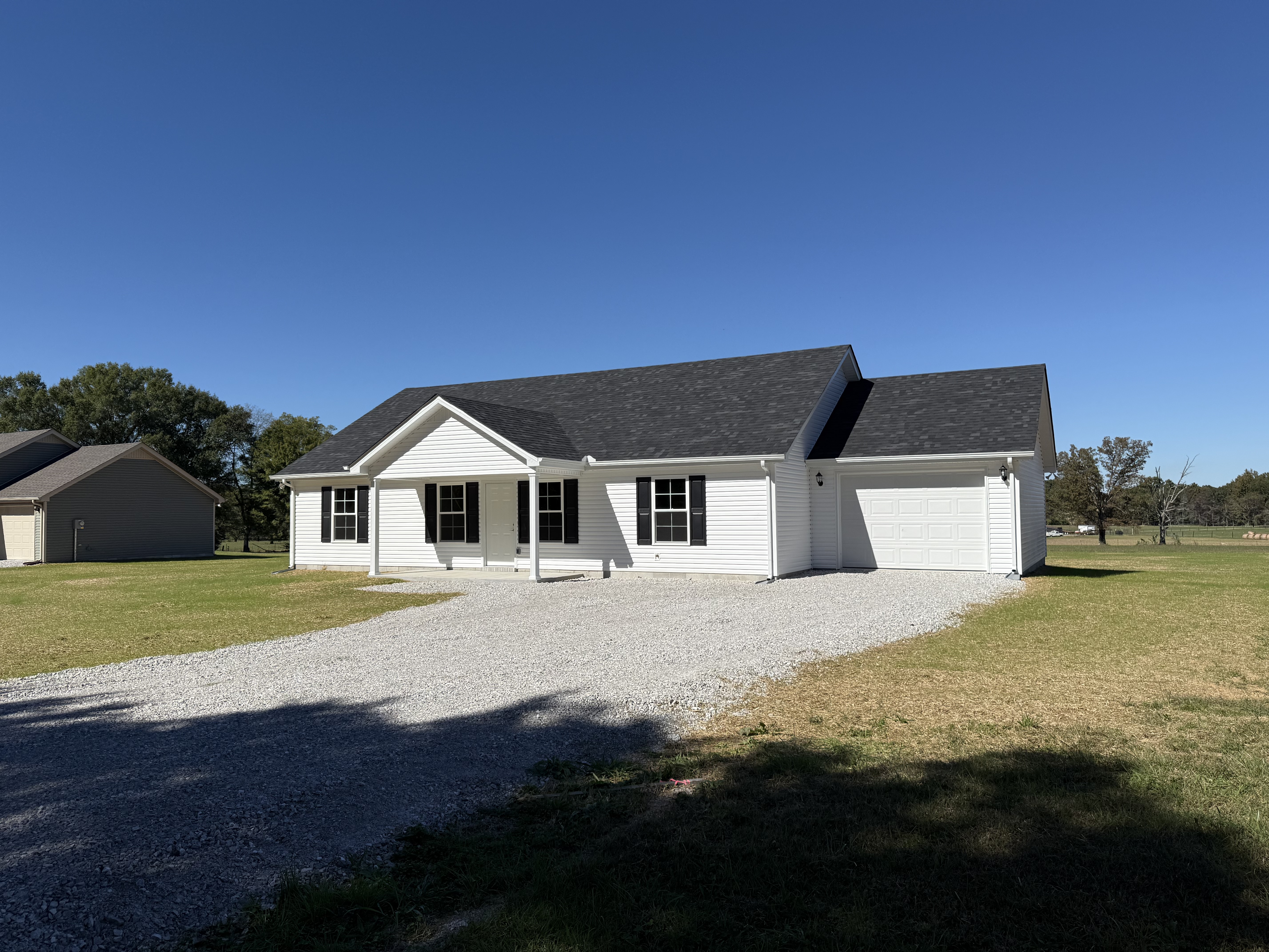 585 Paynes Church Road Estill Springs, TN 37330 - Photo 3 of 34 a front view of a house with a yard
