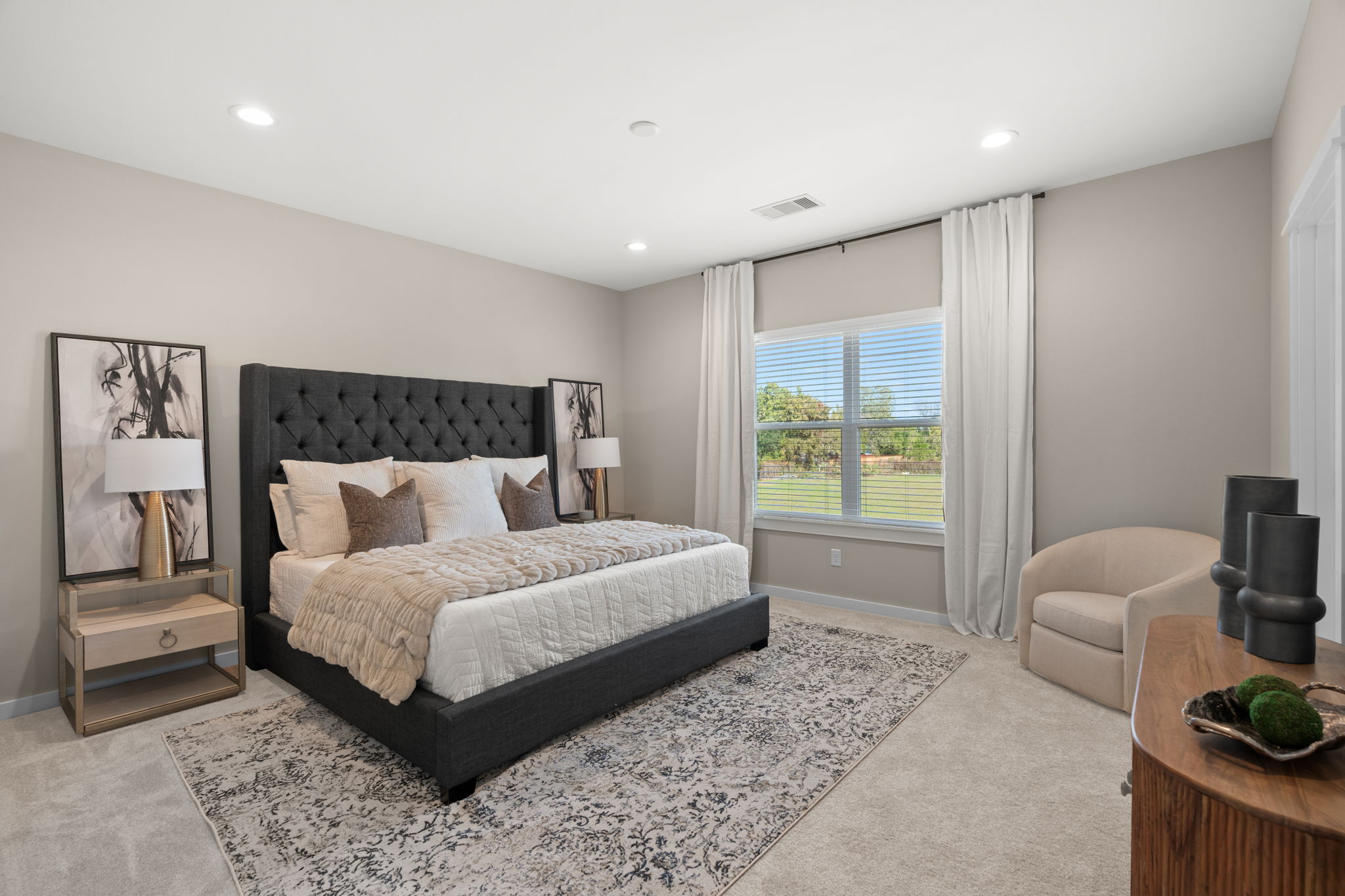 11303 Stonework Grv Lane Houston, TX 77076 - Photo 21 of 39 a spacious bedroom with a bed and a couch