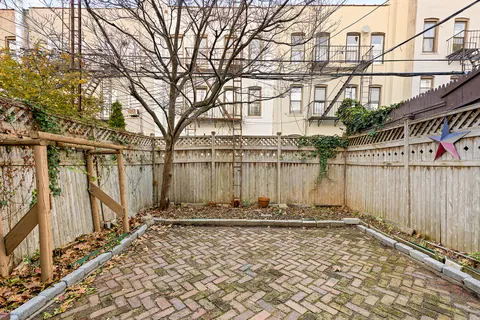 a view of a backyard of the house