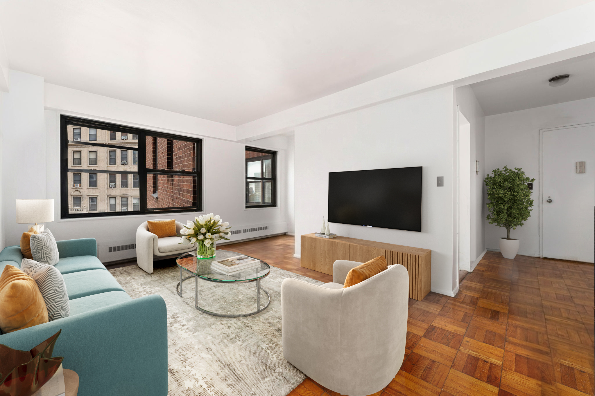 345 West 145th Street, Unit 5A1 Manhattan, NY 10032 - Photo 1 of 9 a living room with furniture and a flat screen tv