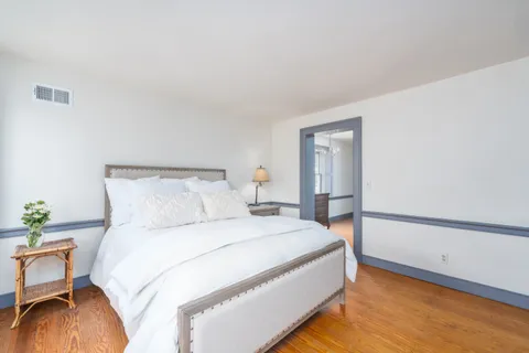 a view of empty room and wooden floor