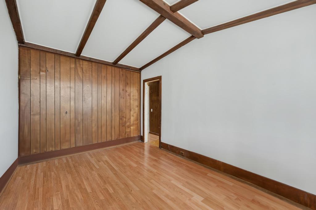 10 Seeley Street Brooklyn, NY 11218 - Photo 10 of 27 a view of an empty room with wooden floor