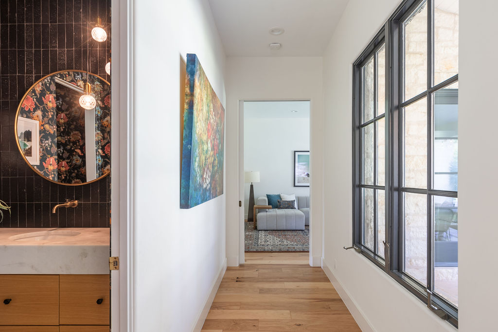 400 Inwood Road Austin, TX 78746 - Photo 18 of 43 a view of a hallway to a livingroom with furniture