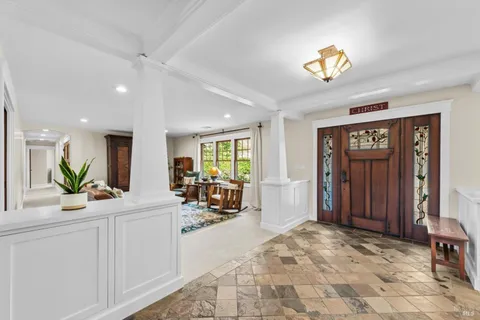 a living room with furniture and a rug