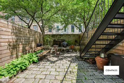 a view of sitting area with chairs in a patio