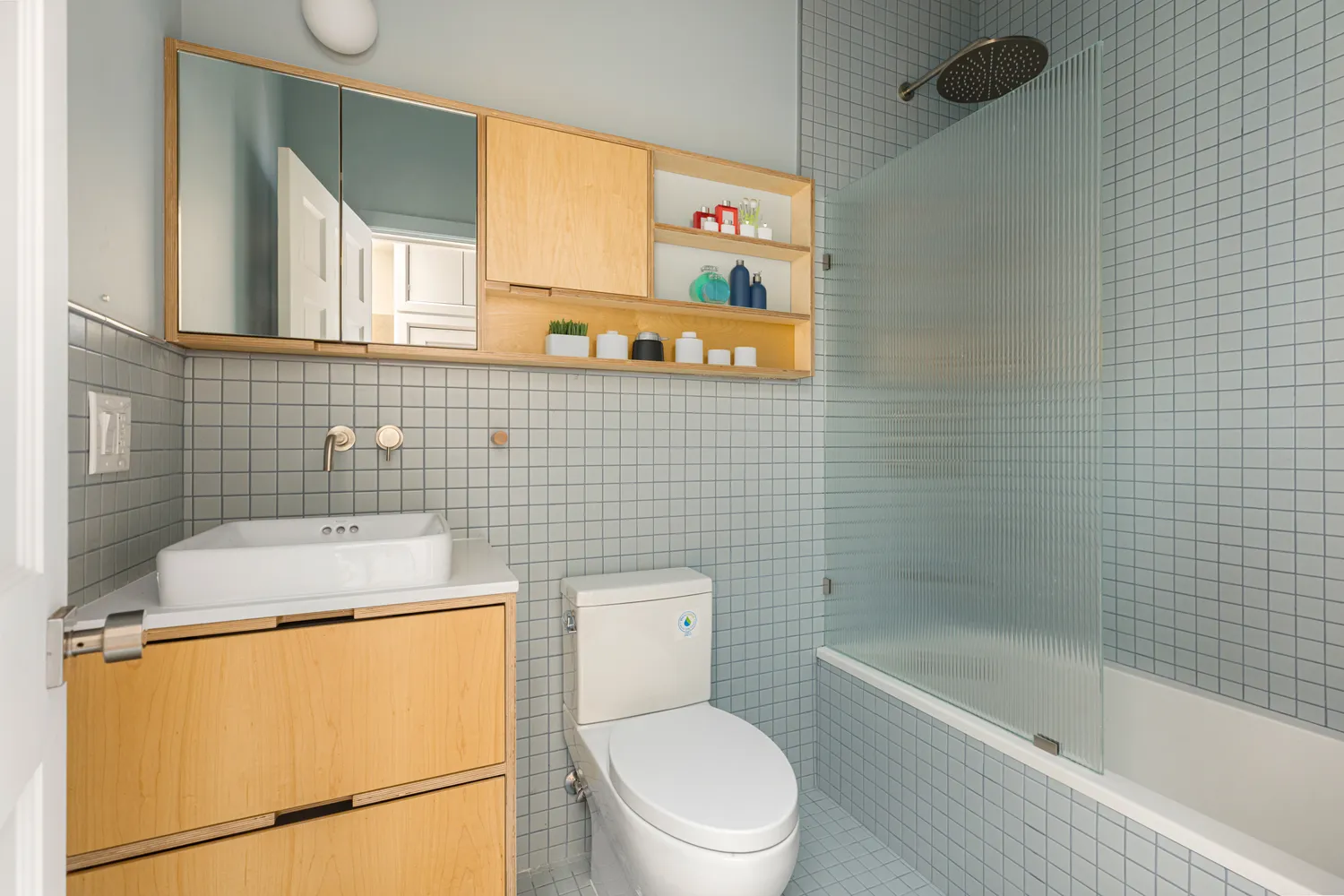 a bathroom with a toilet a sink and bathtub