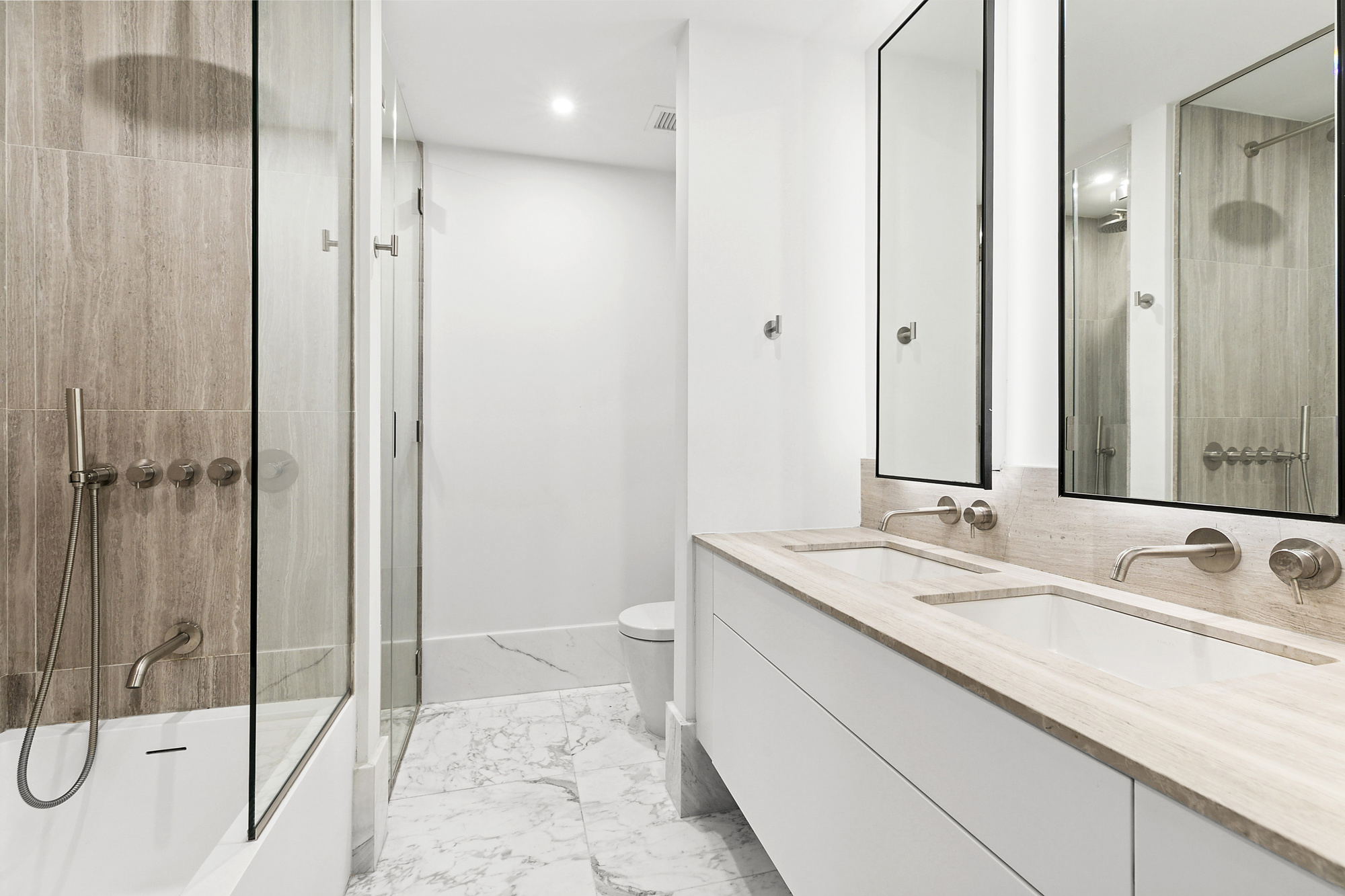 429 Kent Avenue, Unit TH8 Brooklyn, NY 11249 - Photo 12 of 24 a bathroom with a sink and a mirror