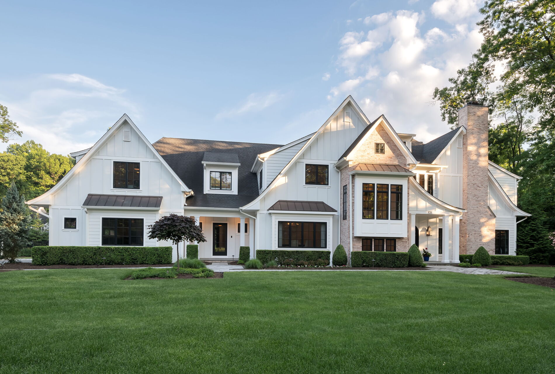 838 Seneca Road Franklin Lakes, NJ 07417 - Photo 2 of 92 a front view of a house with a garden