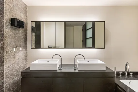 a bathroom with a sink and a mirror