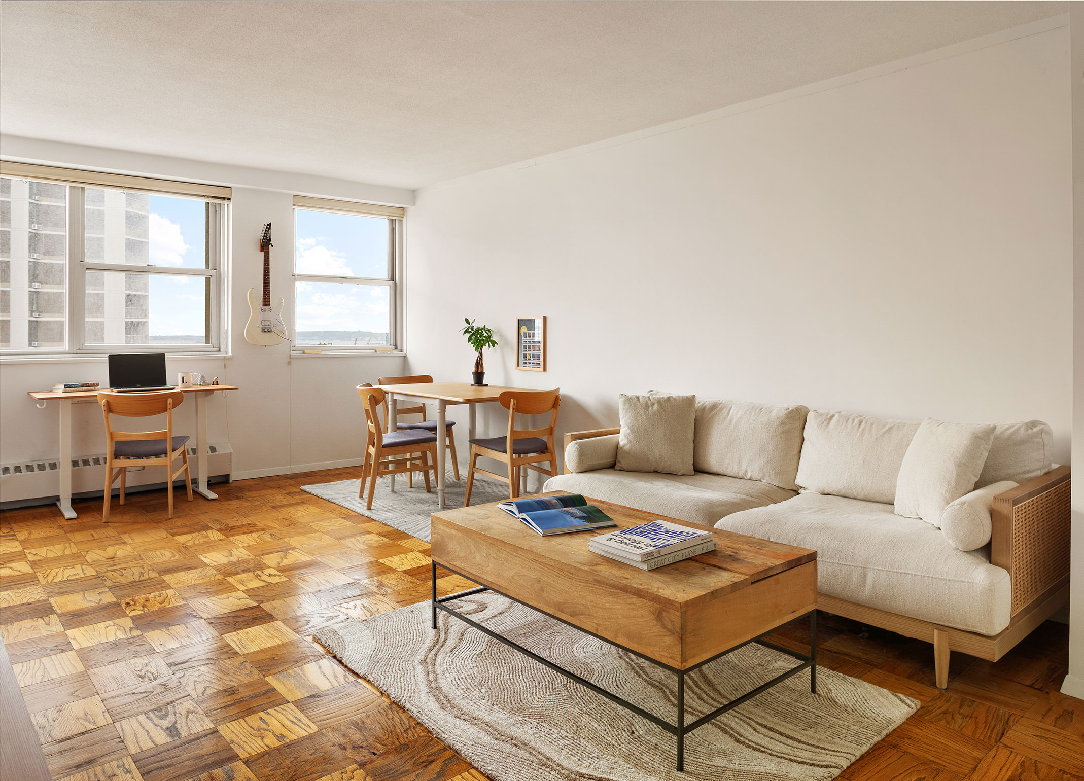 a living room with furniture a table and a window