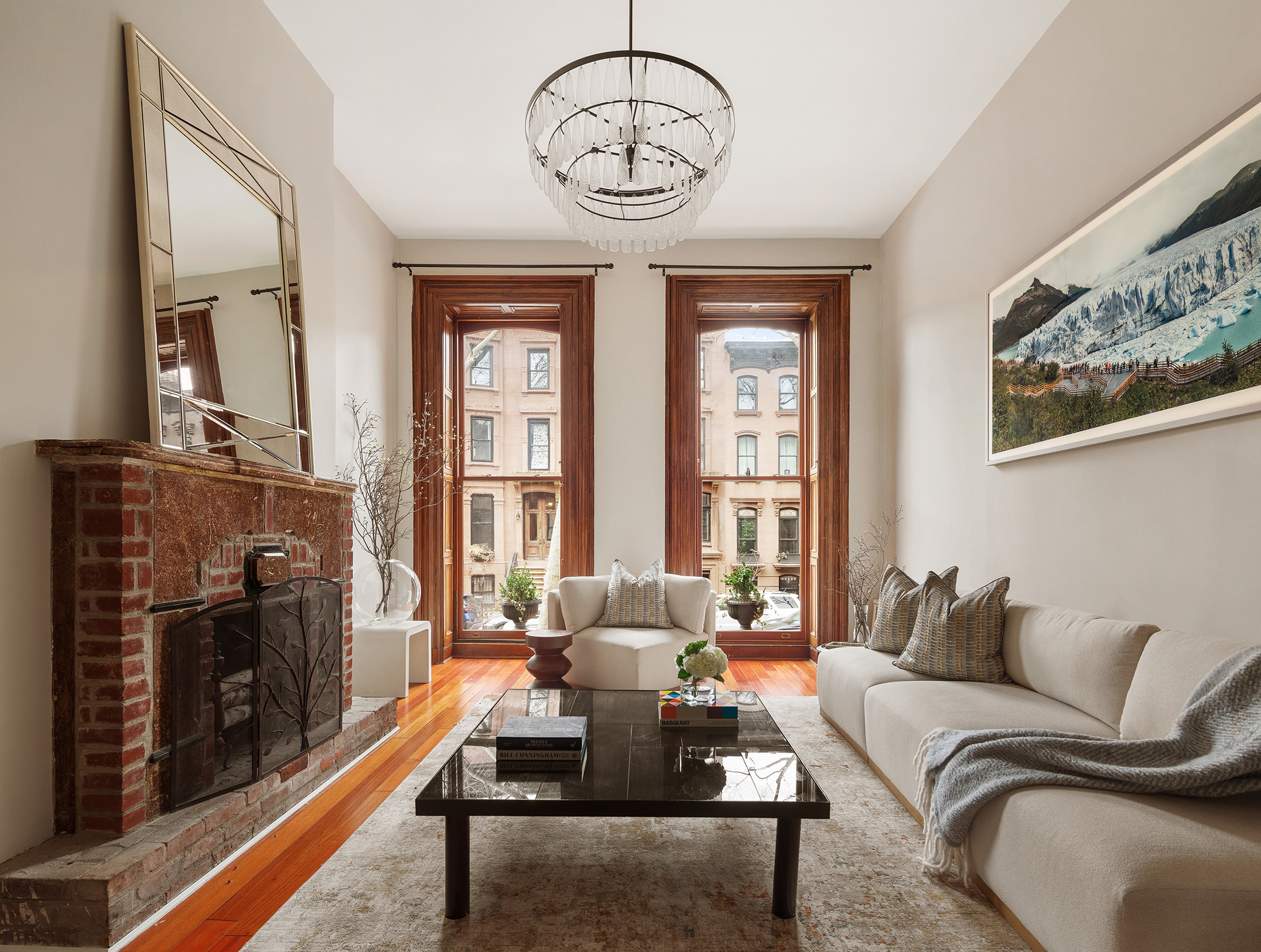 51 South Portland Avenue Brooklyn, NY 11217 - Photo 2 of 18 a living room with furniture a chandelier and a fireplace