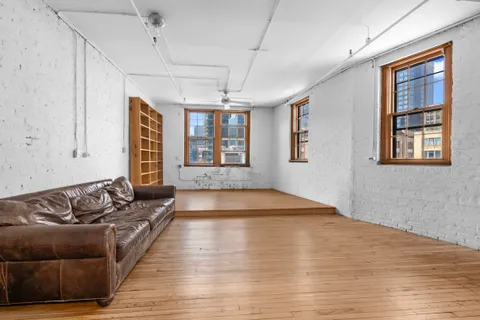 a living room with furniture and windows