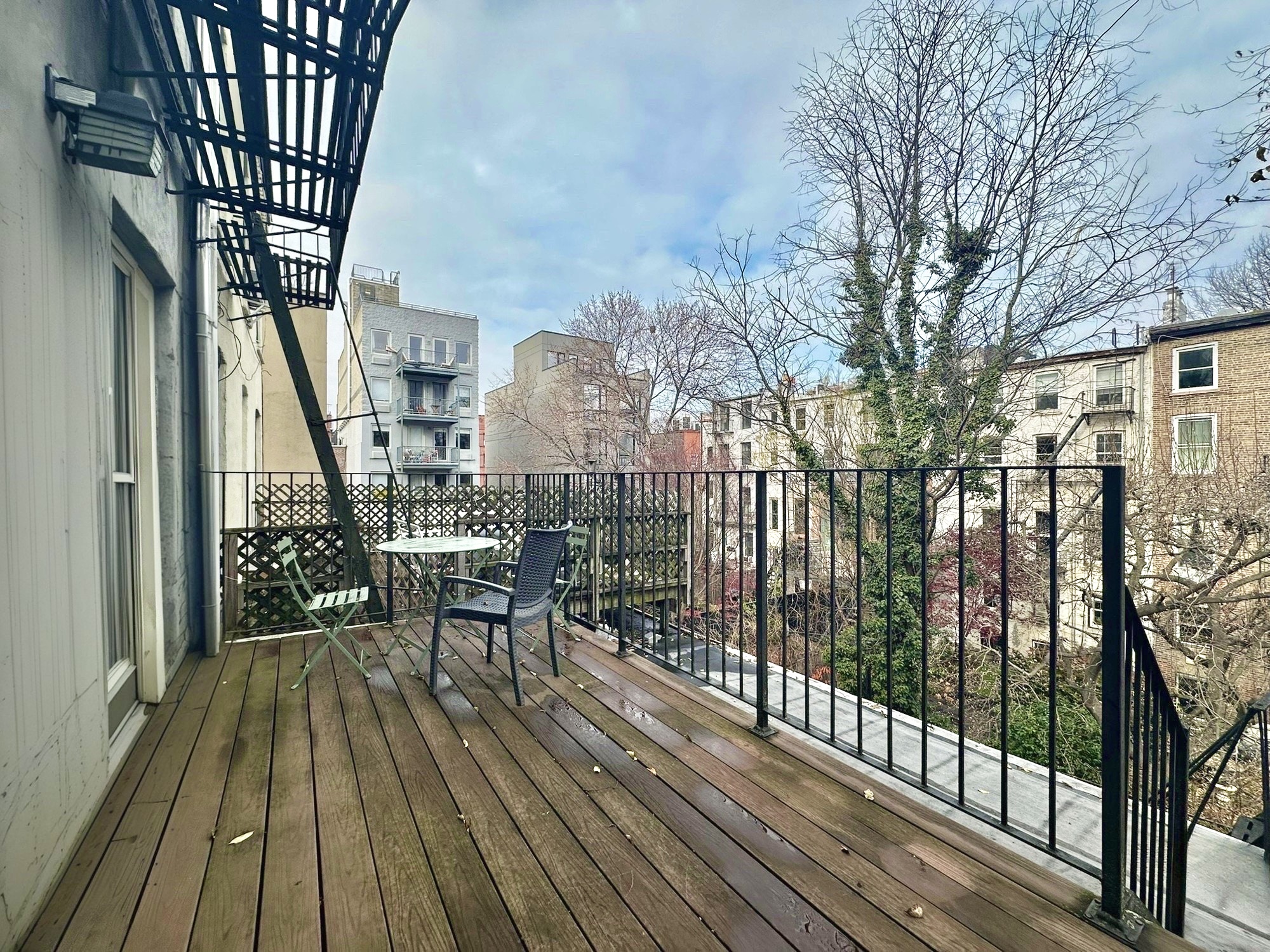 89 Wyckoff Street, Unit 3B Brooklyn, NY 11201 - Photo 7 of 8 a view of balcony with wooden floor and outdoor seating