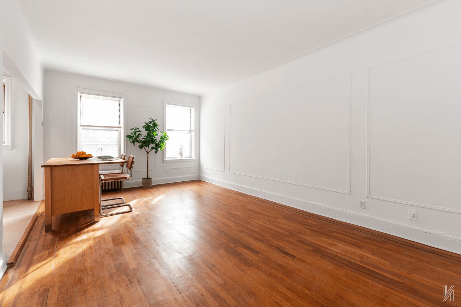 59-11 Queens Boulevard, Unit 3J Queens, NY 11377 - Photo 3 of 18 a living room with furniture and a wooden floor