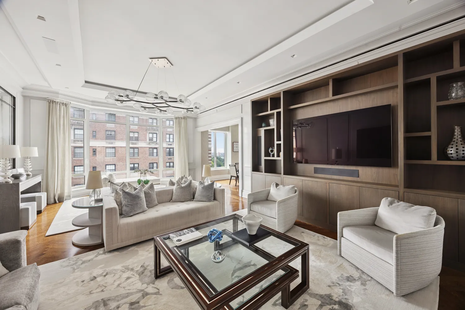 a living room with furniture and a flat screen tv