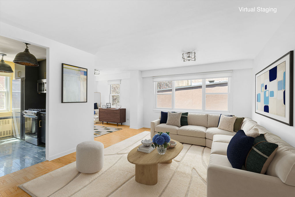 101 West 12th Street, Unit 5V Manhattan, NY 10011 - Photo 2 of 26 a living room with furniture and a window