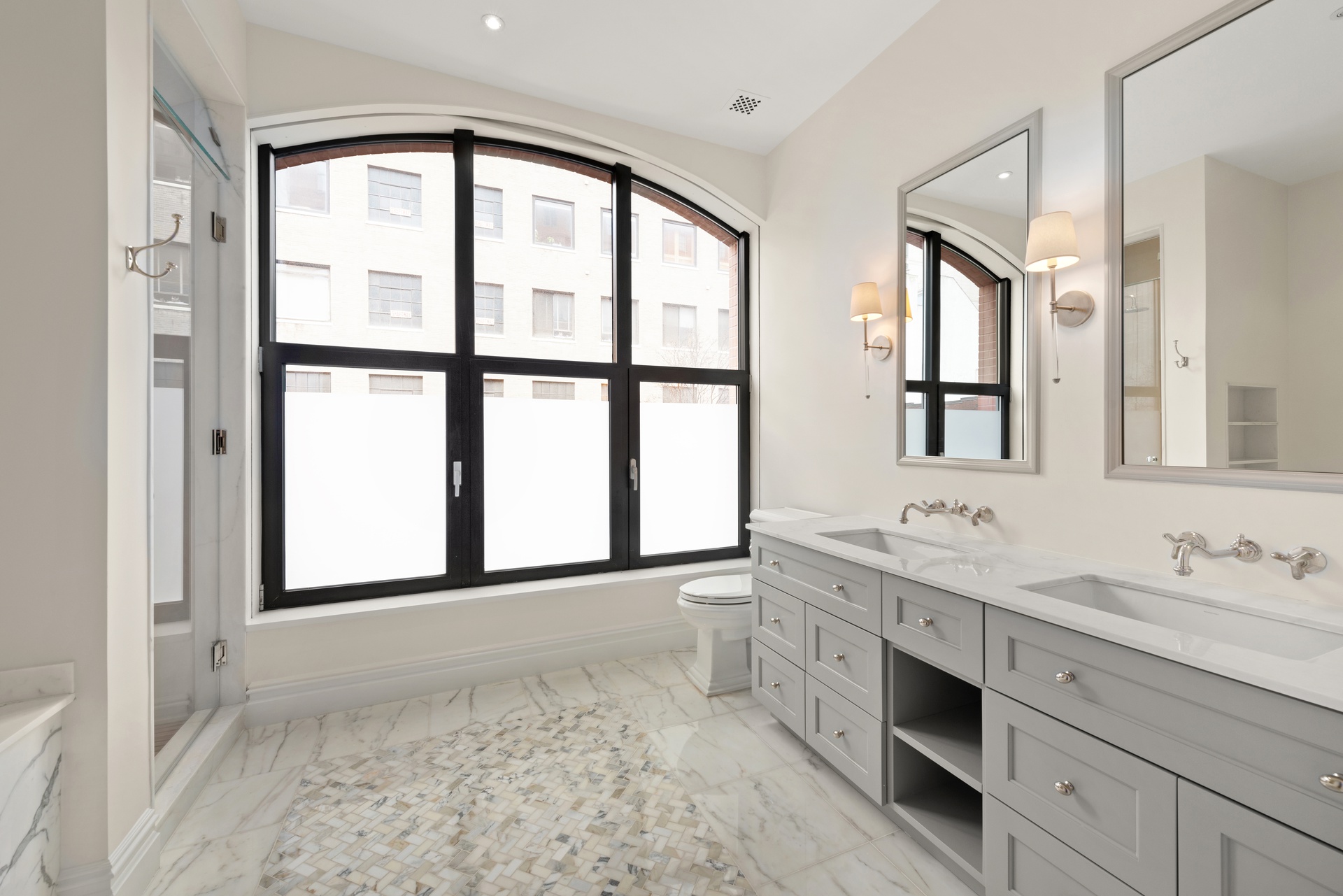 415 Washington Street, Unit 1B Manhattan, NY 10013 - Photo 6 of 16 a bathroom with a double vanity sink mirror and bathtub