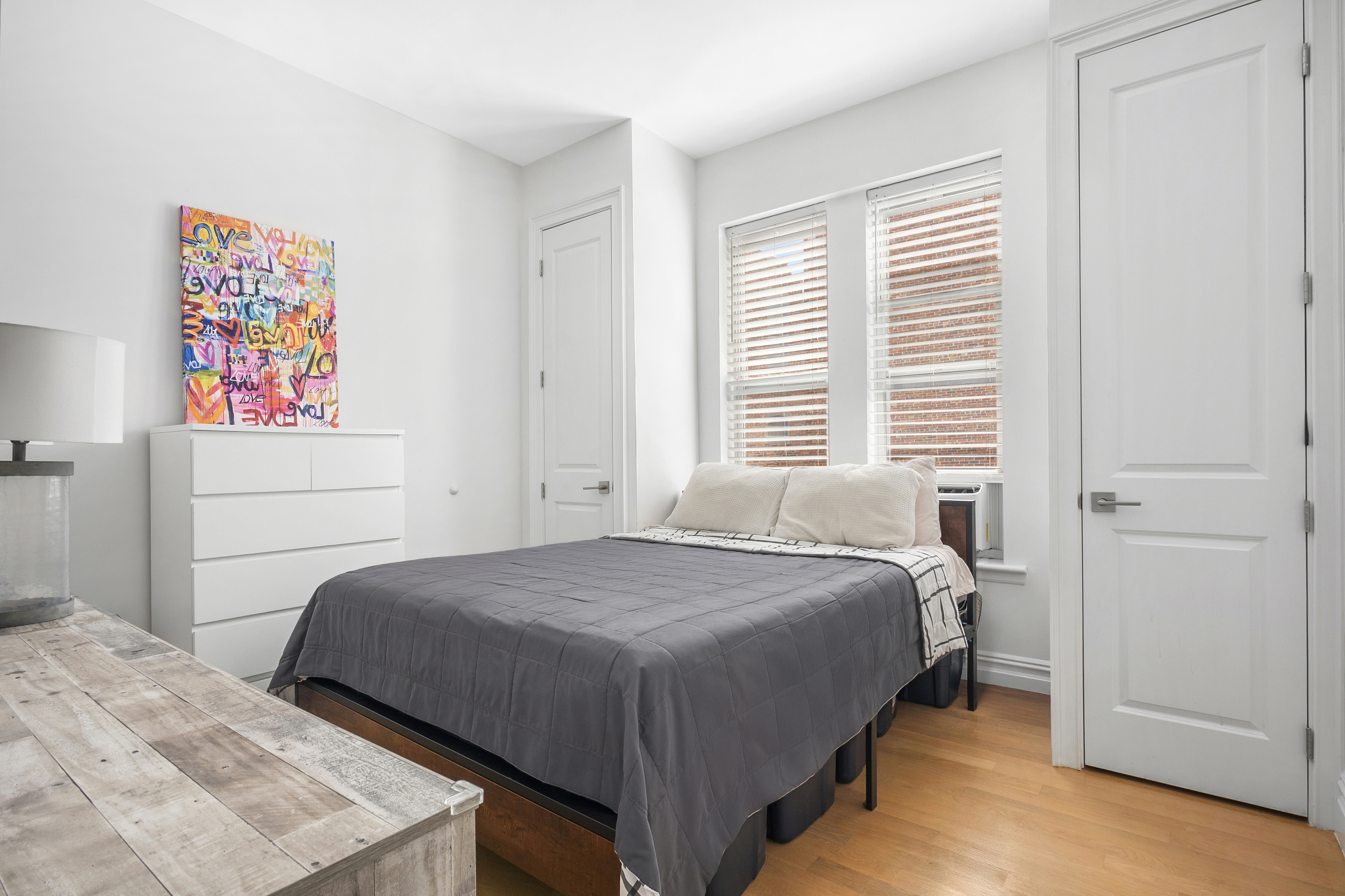 345 West 70th Street, Unit 5E Manhattan, NY 10023 - Photo 4 of 10 a bedroom with a bed and a window