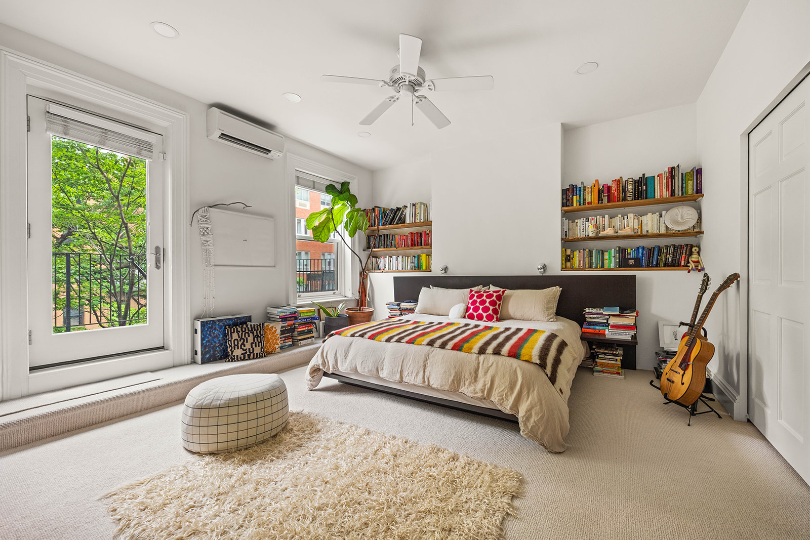 298 State Street, Unit TRIPLEX Brooklyn, NY 11201 - Photo 9 of 21 a bedroom with furniture and a large window