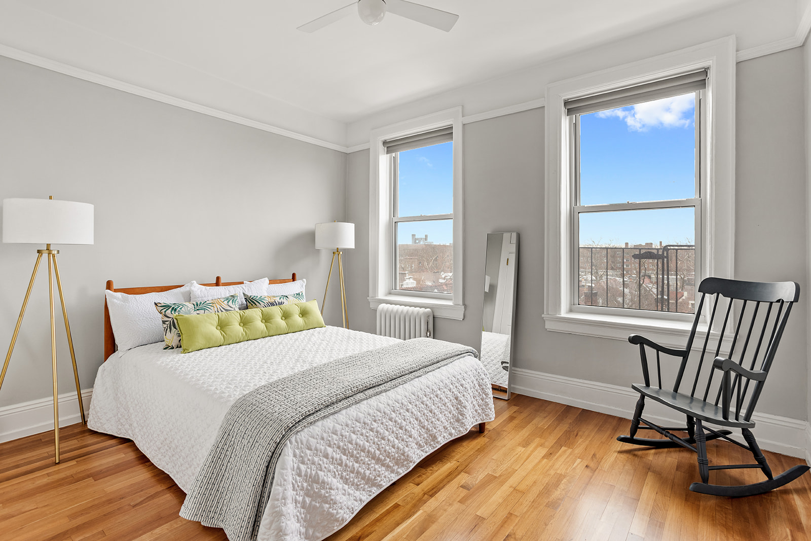 34-43 82nd Street, Unit 51 Queens, NY 11372 - Photo 5 of 12 a bedroom with a bed chair and a large window
