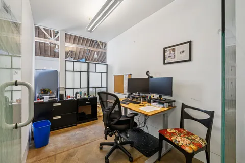 a work room with furniture and a window