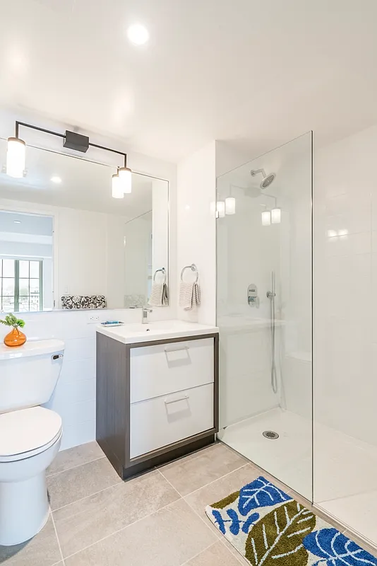 350 Clarkson Avenue, Unit 413 Brooklyn, NY 11226 - Photo 5 of 12 a bathroom with a sink a toilet and shower