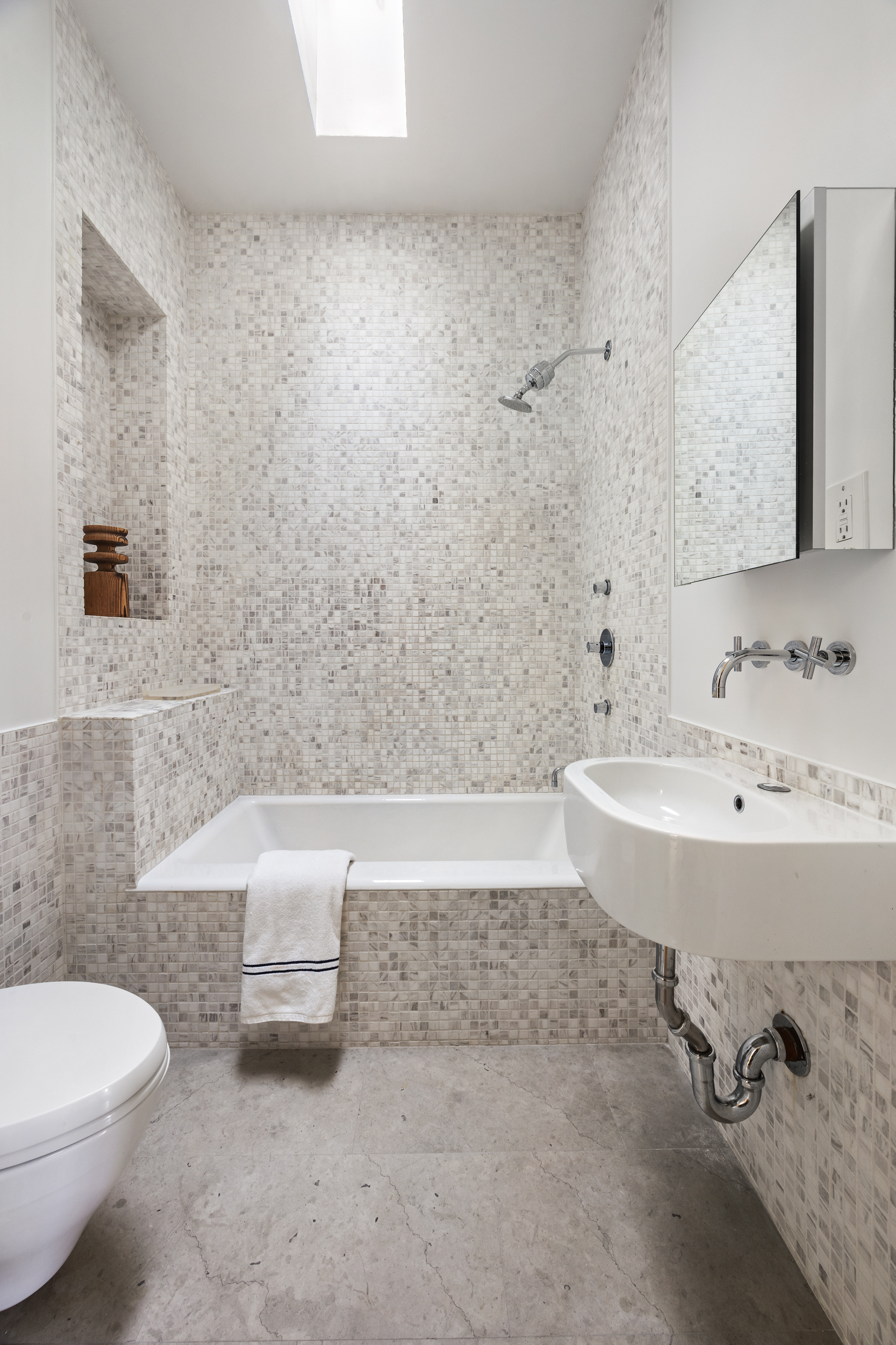 134 Berkeley Place, Unit 3 Brooklyn, NY 11217 - Photo 19 of 30 a bathroom with a sink a toilet and bathtub