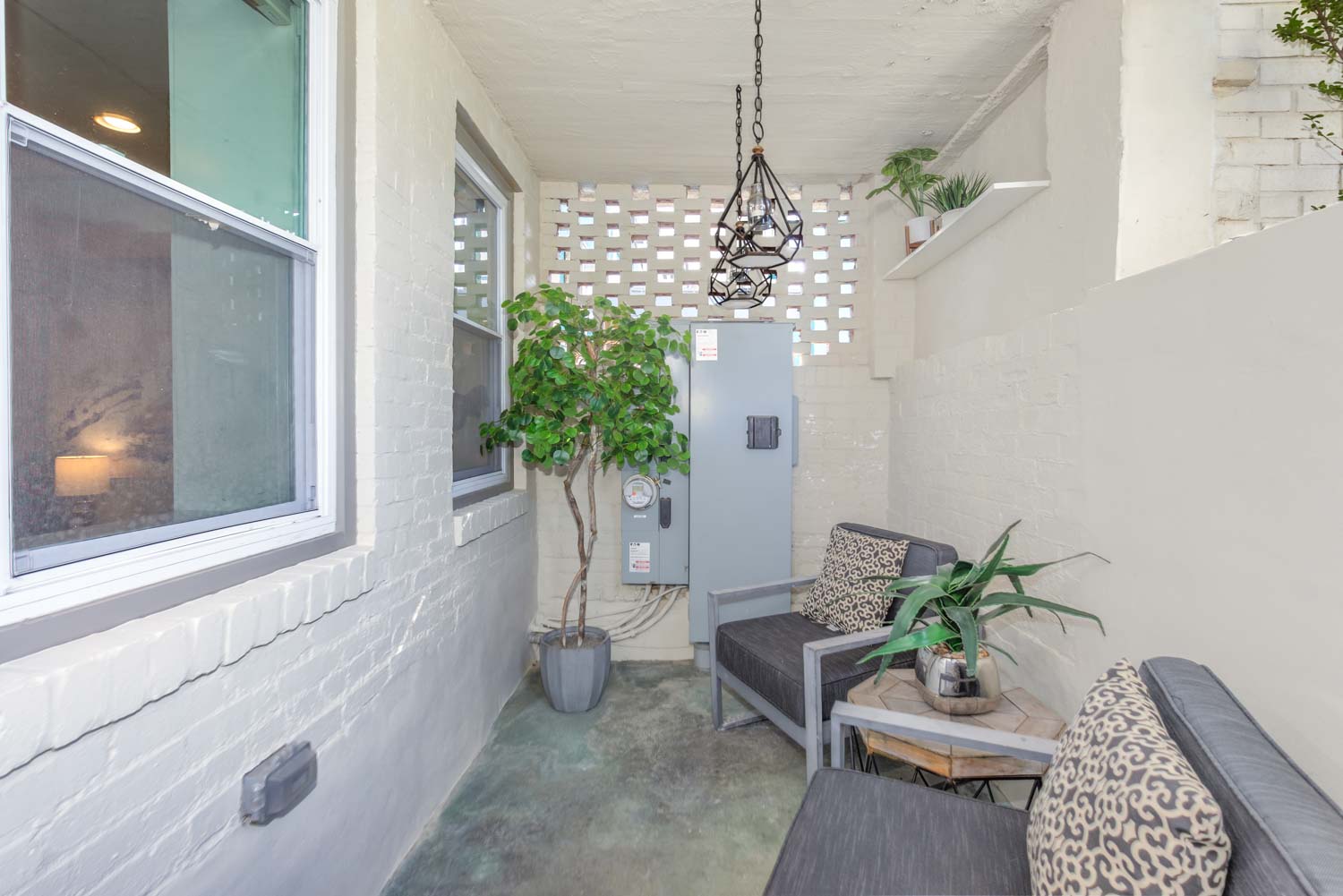 3123 Warder Street Northwest, Unit 1 Washington, DC 20010 - Photo 3 of 24 a vase of flowers sitting on a floor in front of a window