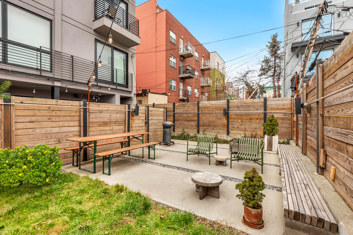 267 Evergreen Avenue, Unit PH Brooklyn, NY 11221 - Photo 15 of 19 a view of a patio with couches and potted plants