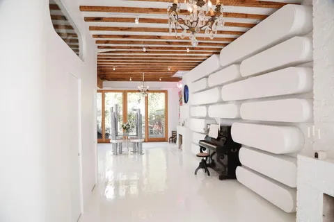 a view of workspace with furniture and floor to ceiling window