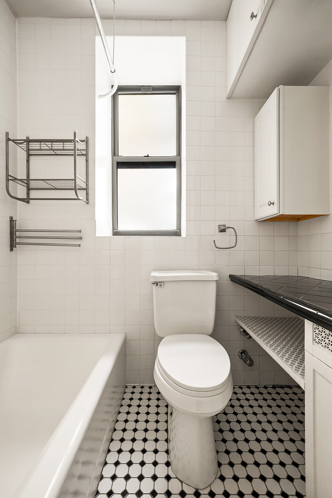 364 West 121st Street, Unit 4A Manhattan, NY 10027 - Photo 7 of 12 a bathroom with a toilet a sink and a window