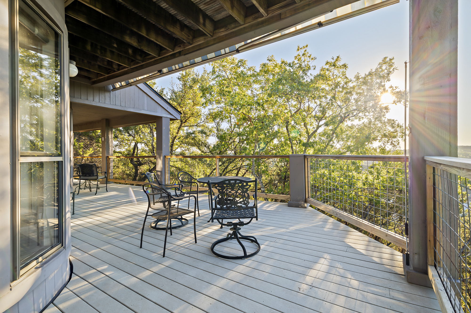 1605 The High Road Austin, TX 78746 - Photo 18 of 45 a view of balcony with wooden floor and outdoor seating