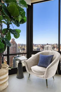 a view of balcony with couch and chairs