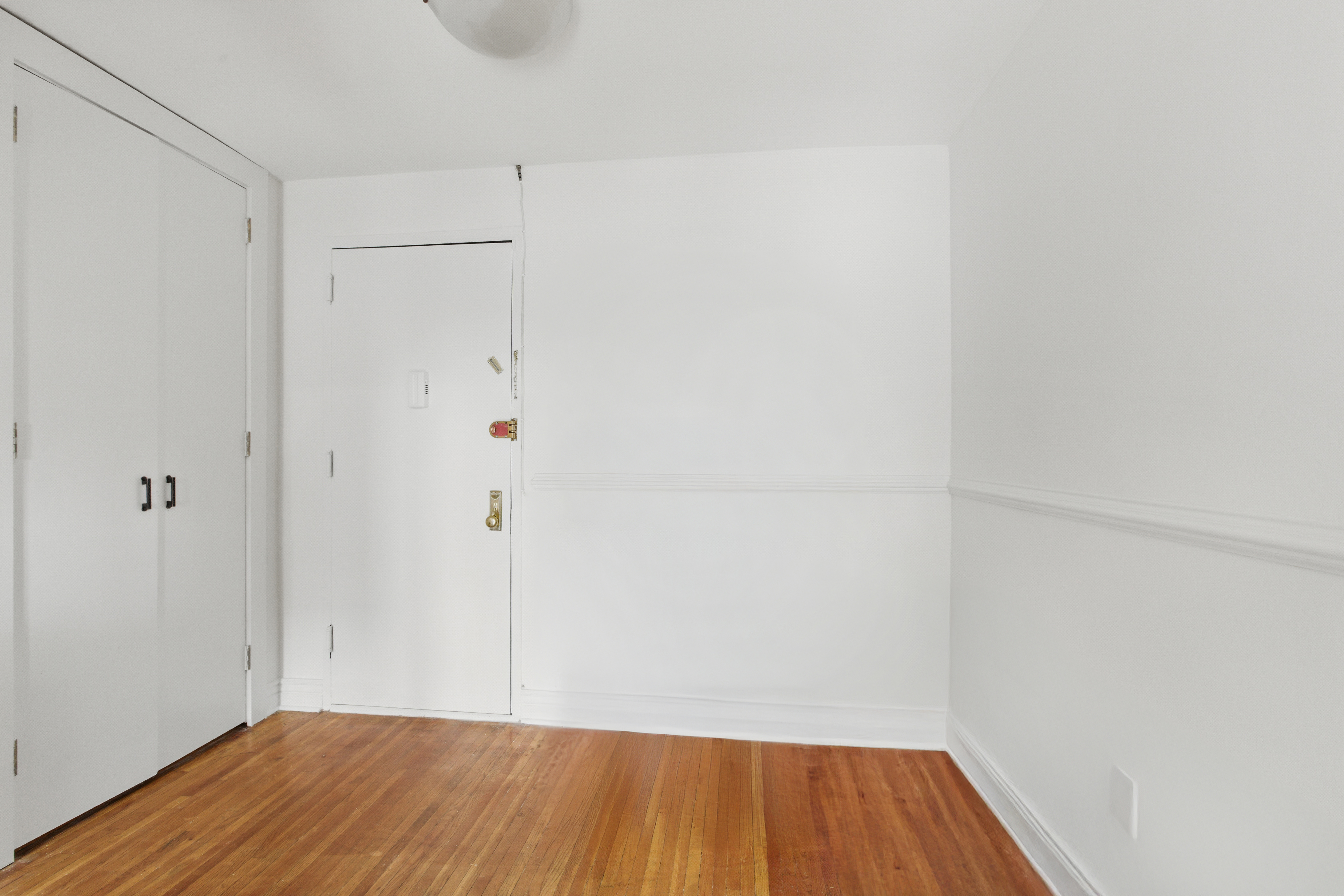 400 East 17th Street, Unit 711 Brooklyn, NY 11226 - Photo 10 of 12 a view of a room with wooden floor