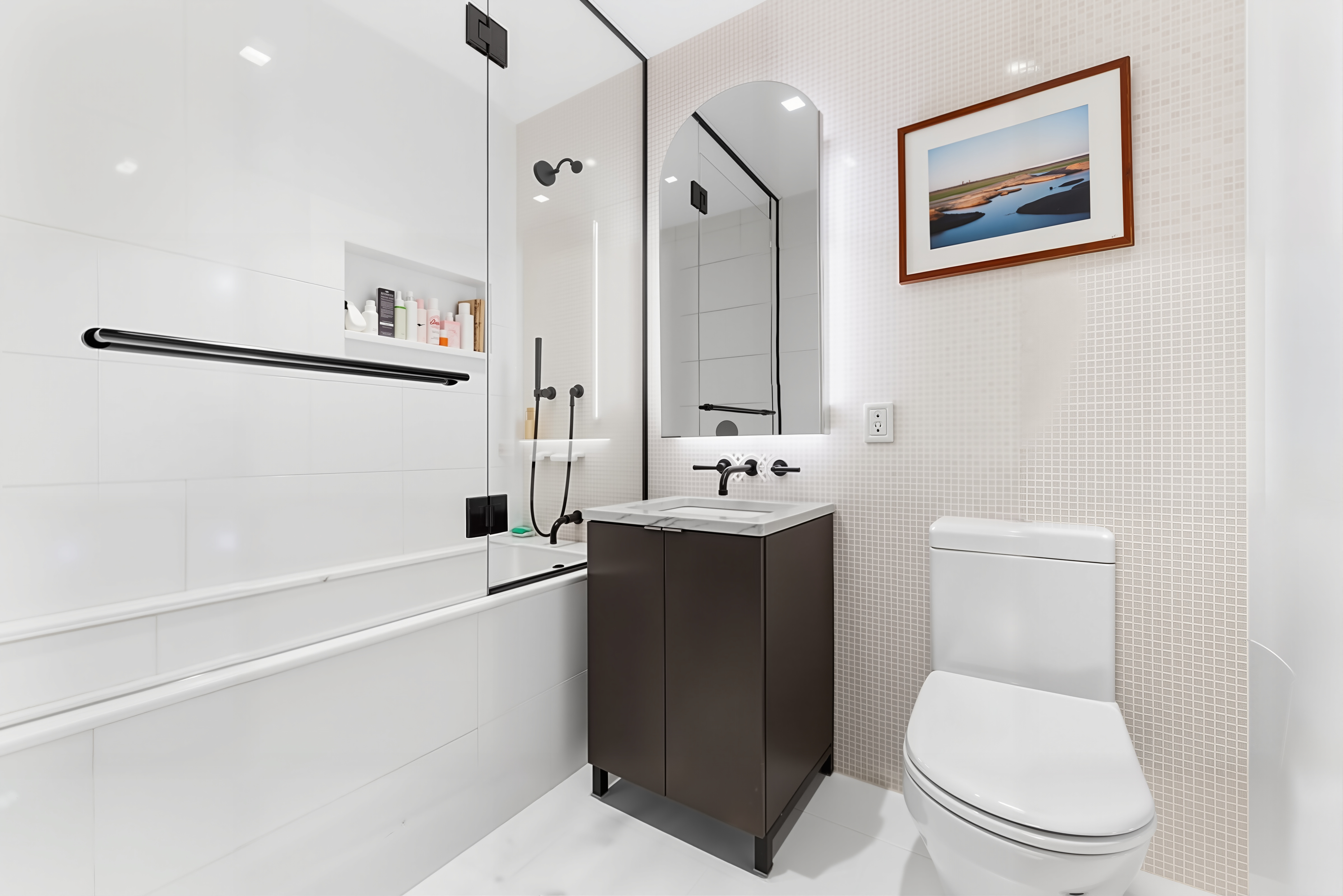 55 West 17th Street, Unit 502 Manhattan, NY 10011 - Photo 6 of 6 a bathroom with a toilet sink and mirror