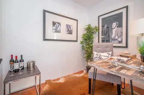 a very nice looking dining room with a table and chairs