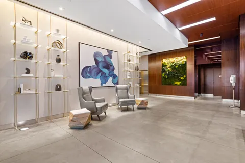 a view of a hallway with dining area