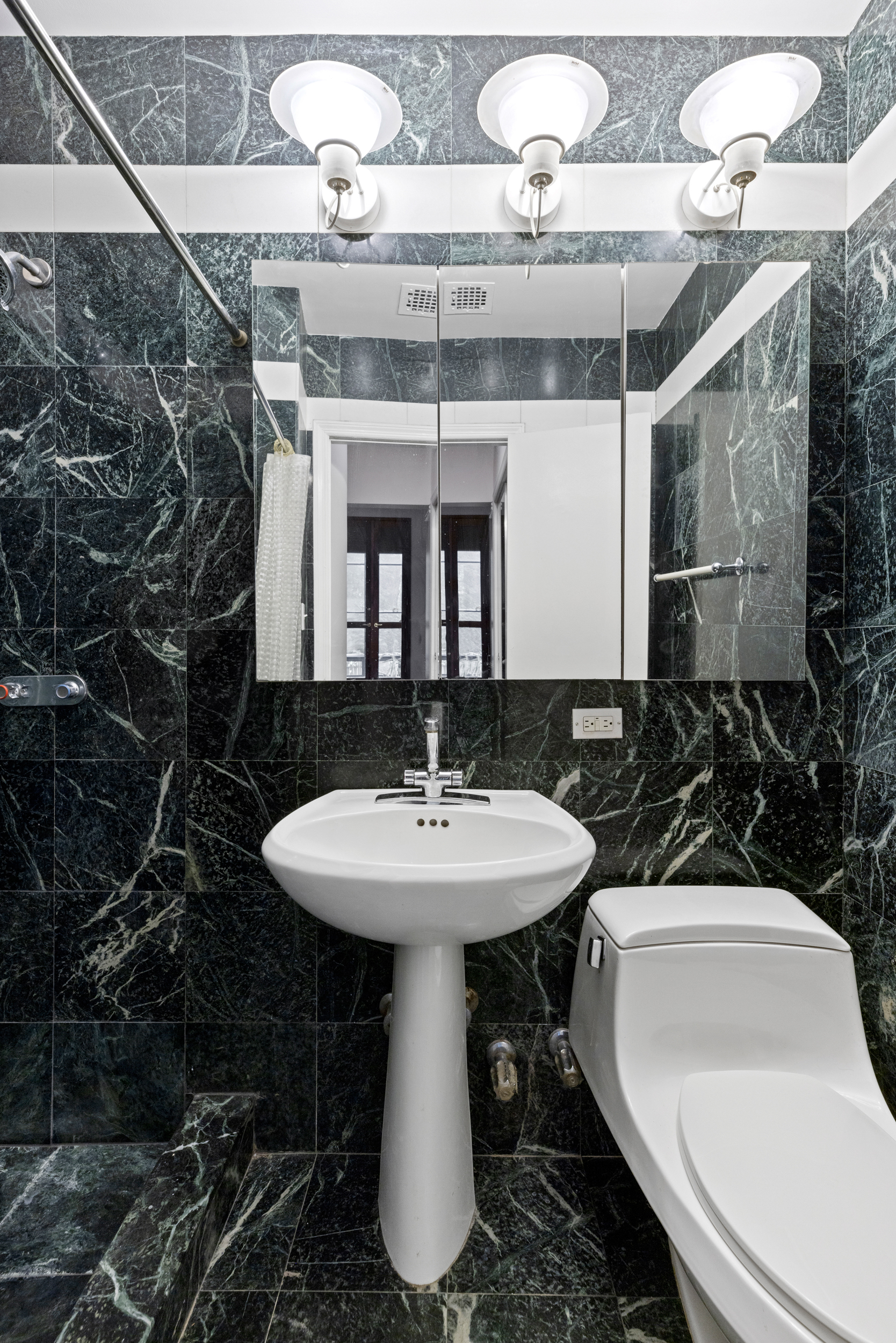 136 East 30th Street, Unit DUPLEX Manhattan, NY 10016 - Photo 23 of 26 a bathroom with a sink toilet and shower